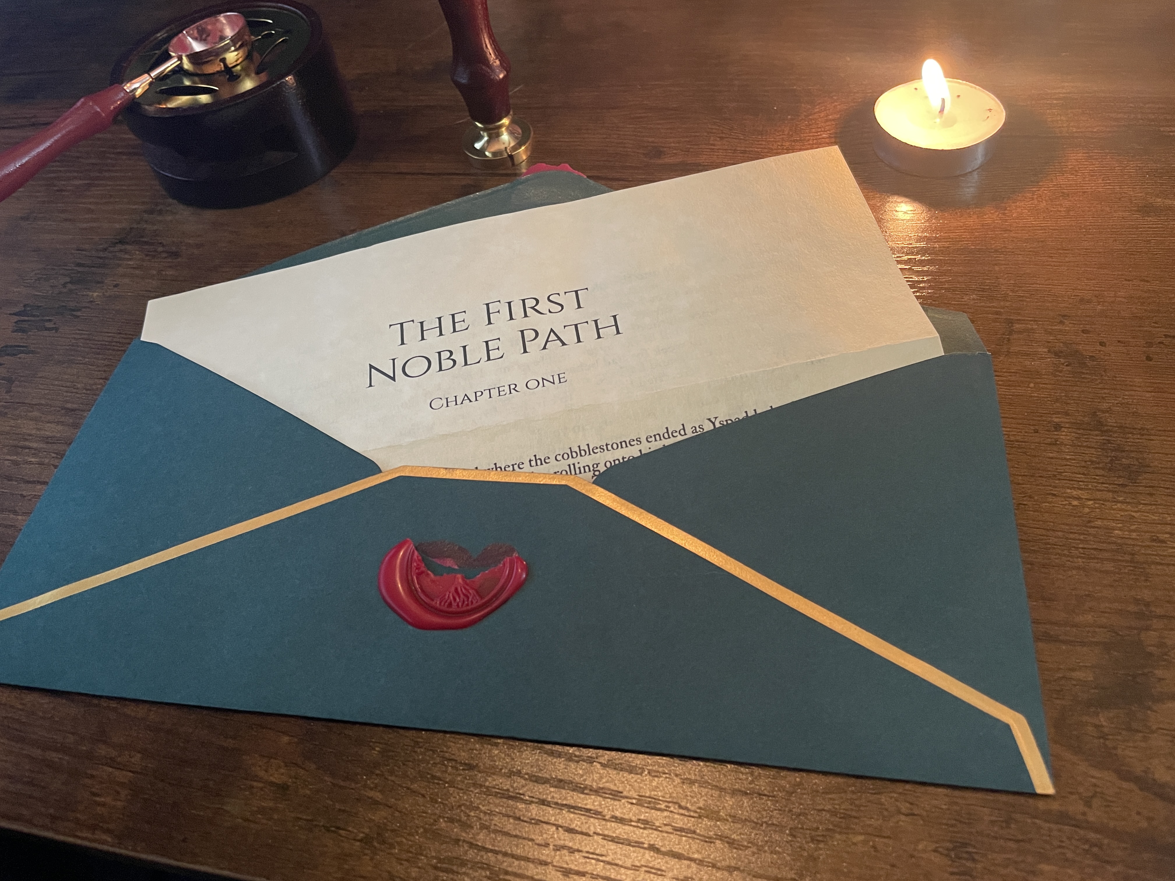 The same envelope opened, its wax seal broken, beside a wax stamp and an ink pot